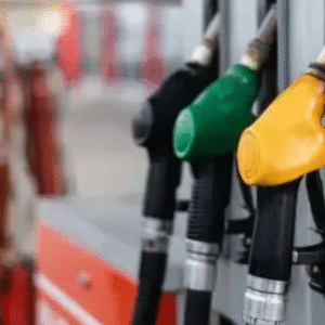 Fuel nozzles at a petrol station, including diesel, petrol, and alternative fuel options.