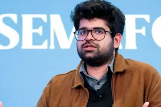 Pratik Sinha of Alt News speaks at an event, gesturing with his hands.