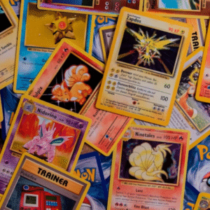 A vibrant, overhead shot of numerous classic Pokémon trading cards scattered.