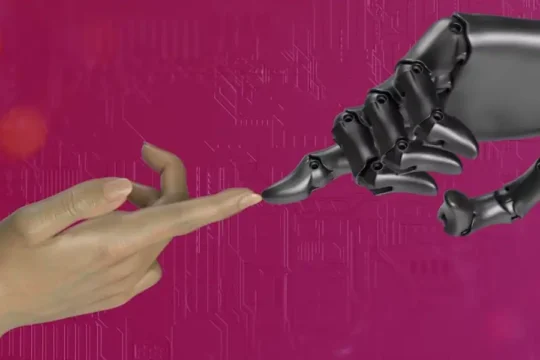 A human hand and a robotic hand touch fingertips against a pink, tech-inspired background.
