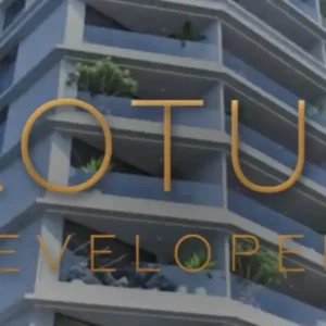 A tall, modern building with "LOTUS DEVELOPERS" text overlaid.