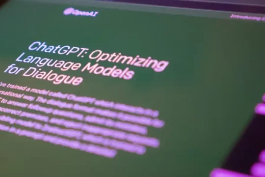 Close-up of a screen displaying the "ChatGPT: Optimizing Language Models" page.