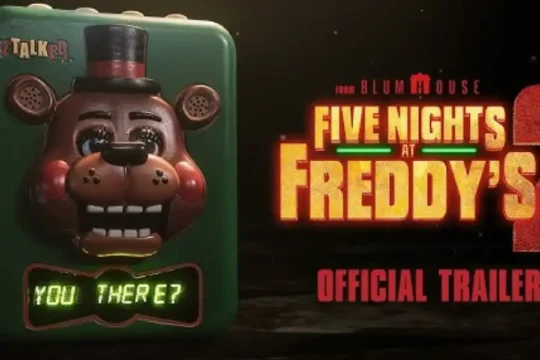 "Five Nights at Freddy's 2" movie trailer poster with Freddy Fazbear toy.