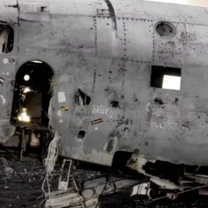 The wreckage of a US Navy DC-3 plane on a black sand beach in Iceland