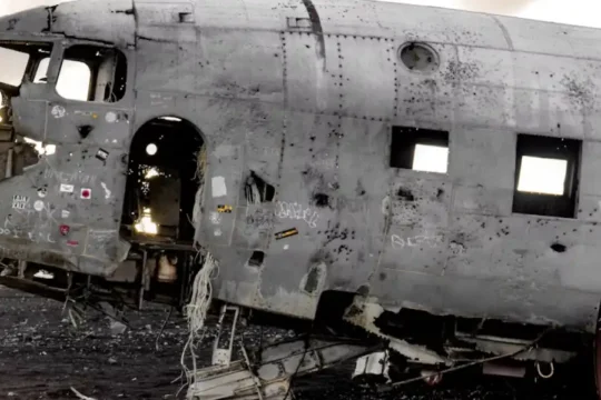 The wreckage of a US Navy DC-3 plane on a black sand beach in Iceland