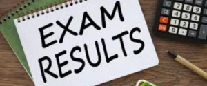 Notepad with "EXAM RESULTS" written, next to a calculator and pen.