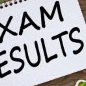 Notepad with "EXAM RESULTS" written, next to a calculator and pen.