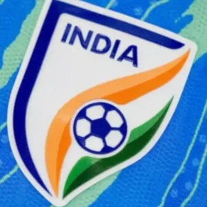 Close-up of the India football team badge on a blue jersey.