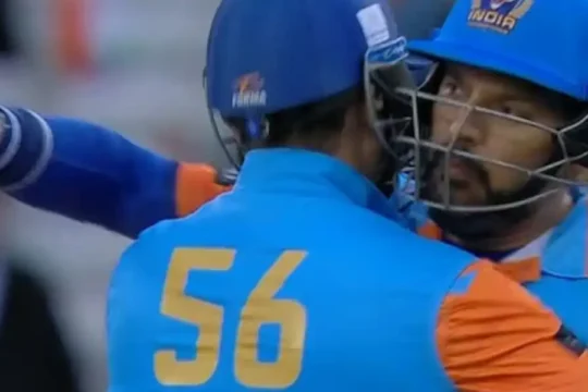 Two Indian cricketers, one with "Irfan" and "56" on his back, embracing
