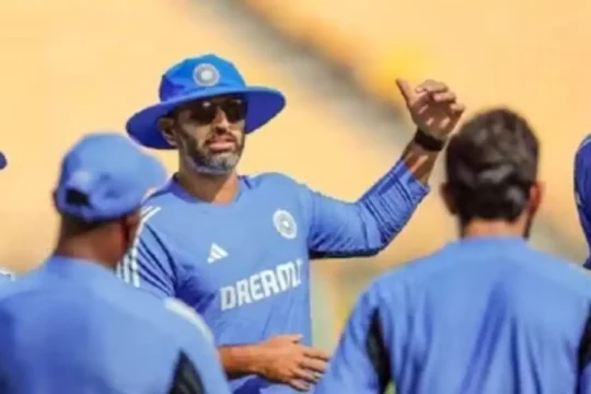 Cricket coach Gautam Gambhir addresses players in blue training uniform