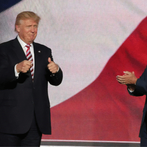 Donald Trump gives thumbs up; Mike Pence claps.