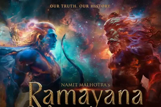 The movie poster for Namit Malhotra's "Ramayana," featuring Lord Rama and Ravana in a celestial setting.