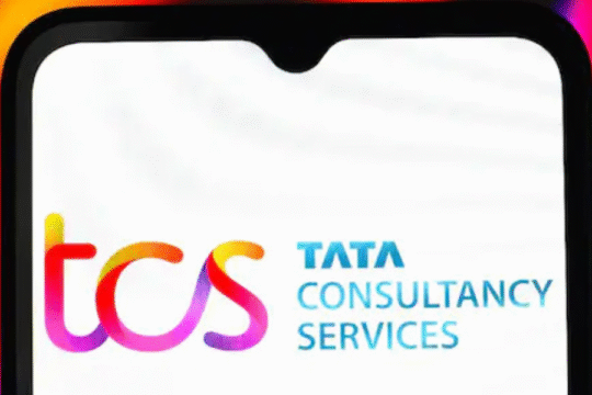 A smartphone displaying the Tata Consultancy Services (TCS) logo.