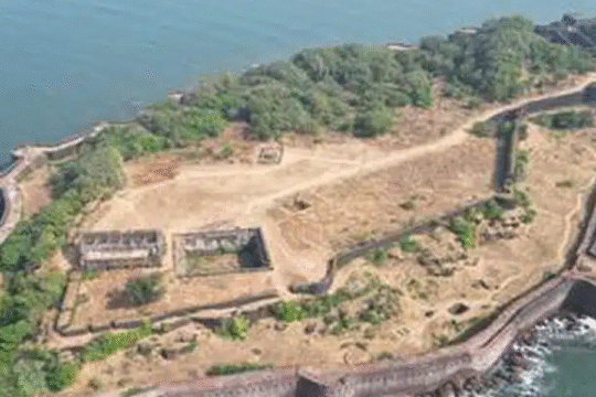 An aerial view of a historical fort situated on a rocky island surrounded by water.