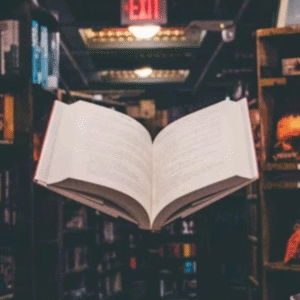 Open book floating in a dimly lit library aisle