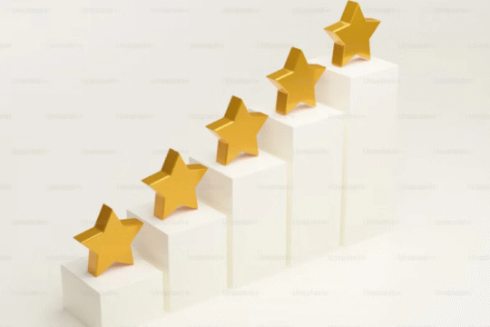Five golden stars placed on ascending white blocks, symbolizing rating or success.