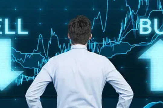 A man in a white shirt stands in front of a digital stock market chart with glowing "SELL" and "BUY" arrows indicating market decision points.