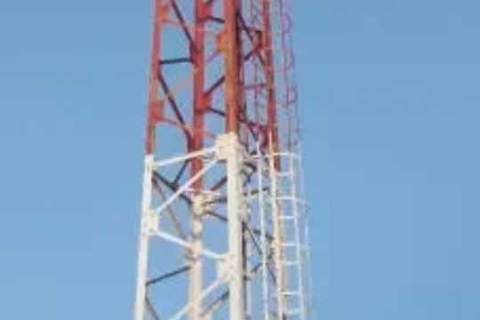 A man in a white shirt stands in front of a digital stock market chart with glowing "SELL" and "BUY" arrows indicating market decision points.