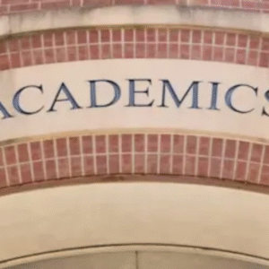 Entrance to an academic building with "ACADEMICS" inscribed on an arch