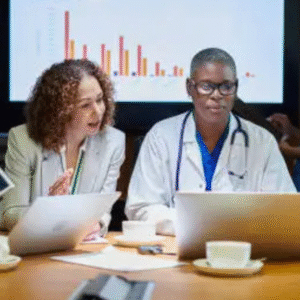 Medical professionals and executives in a meeting discussing healthcare data