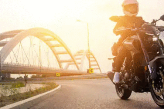 A man riding bike in a sunny day.