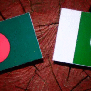 Flags of Bangladesh and Pakistan placed side by side on a wooden background, symbolizing a cricket rivalry or diplomatic relationship.