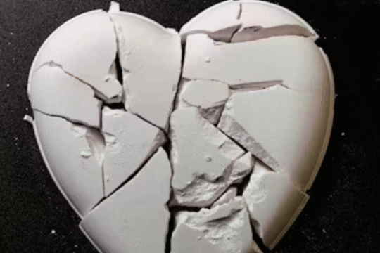 Shattered white heart symbolizing emotional pain and heartbreak