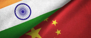 Close-up of Indian and Chinese flags overlapping, symbolizing bilateral relations.