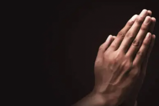 In the black colour background hands are spotlighted