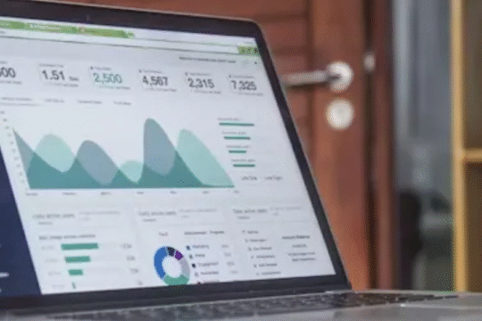 Laptop screen displaying business analytics and data dashboards