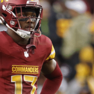 An American football player in a burgundy Commanders jersey with the number 17.