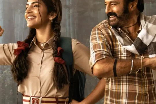Sreeleela and Nandamuri Balakrishna smiling and flexing their arms.
