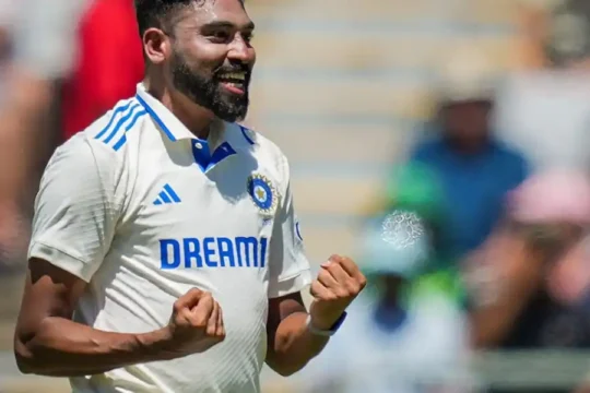 Indian cricketer Mohammed Siraj celebrates taking a wicket during a match.