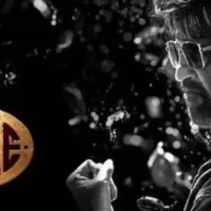 Black and white movie poster for 'Coolie' starring Rajinikanth.