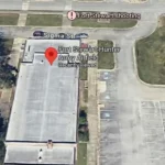 A satellite map view showing a building and a parking lot at Fort Stewart-Hunter Army Airfield.