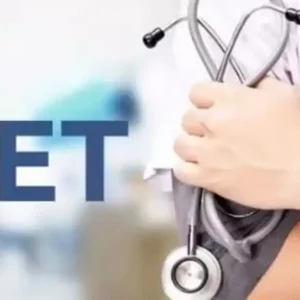 A doctor in a white coat holding a stethoscope, with the word "NEET" in the foreground.